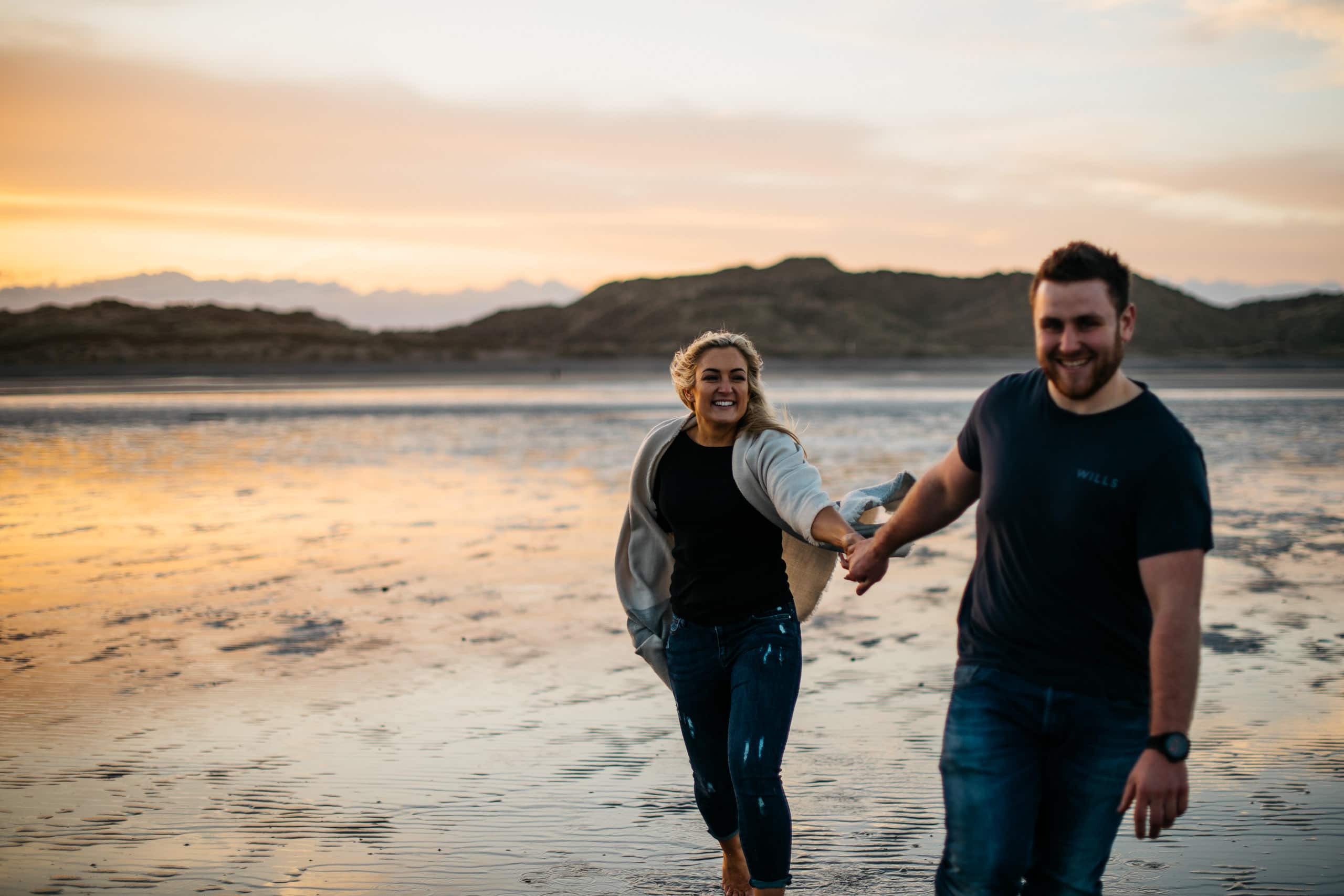 holding hands at sunset Engagement Photography Belfast