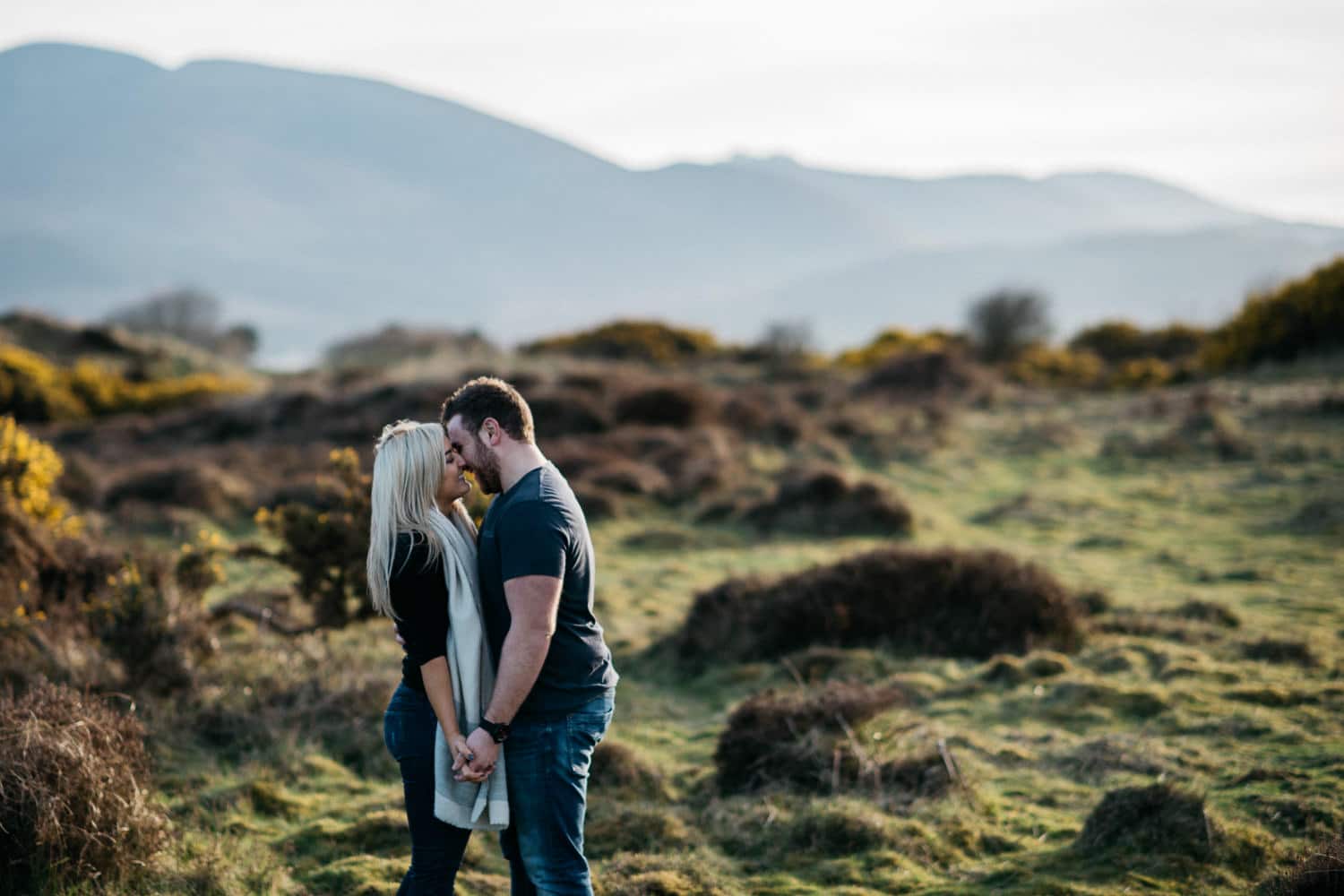 couple kissing and laughing