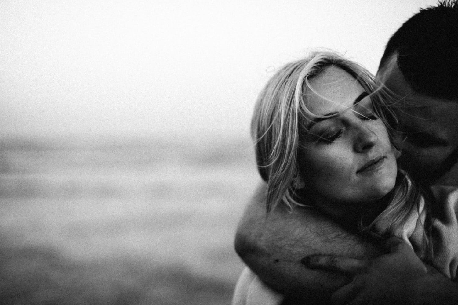 close up of couple kissing black and white engagement photos