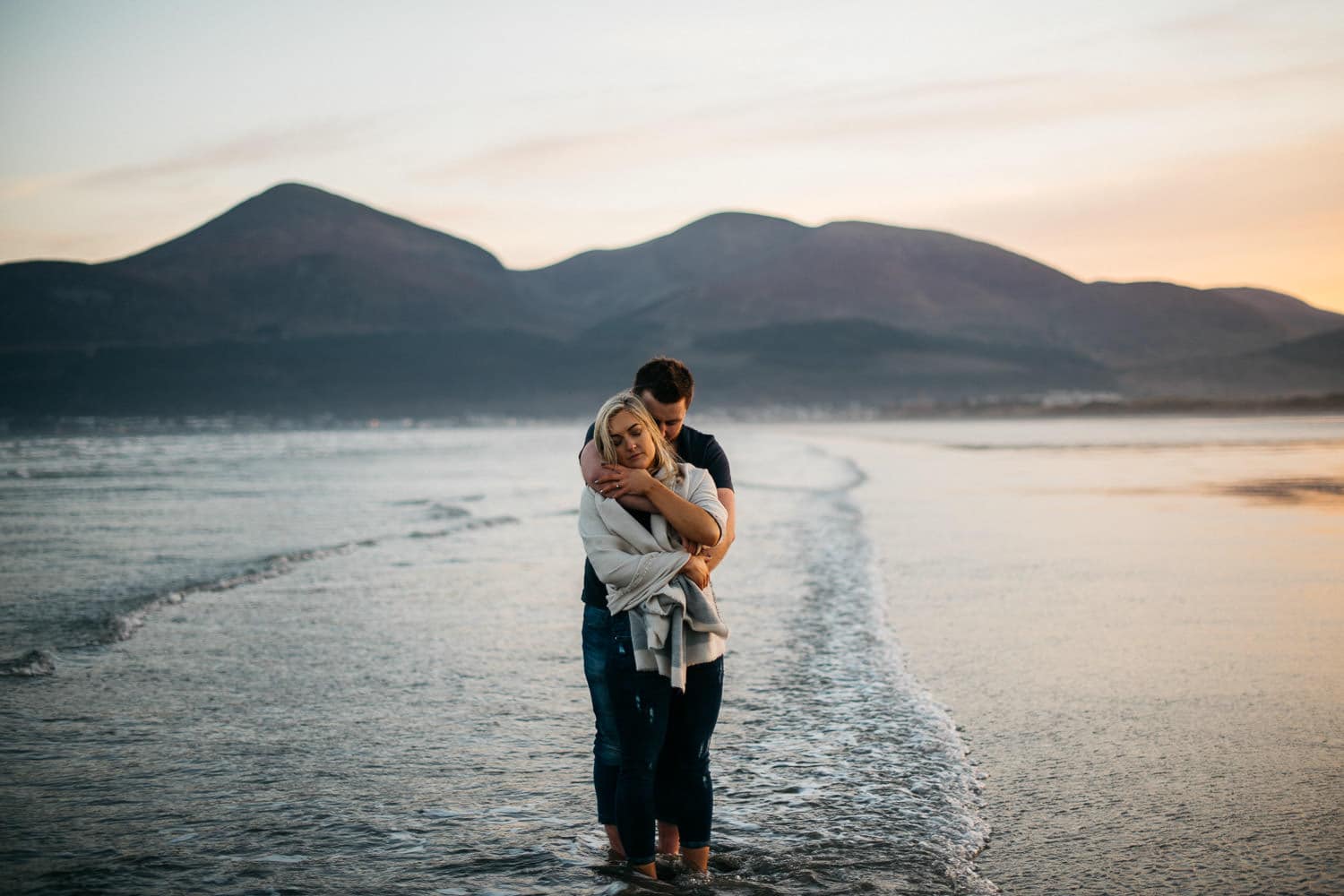 couple hugging with in front of slieve donard Engagement Photography Belfast