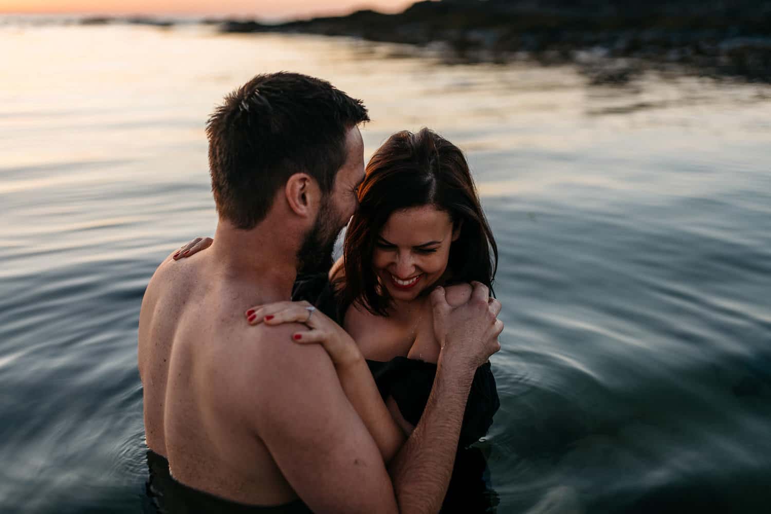 couple playing in the water Engagement Photography Northern Ireland