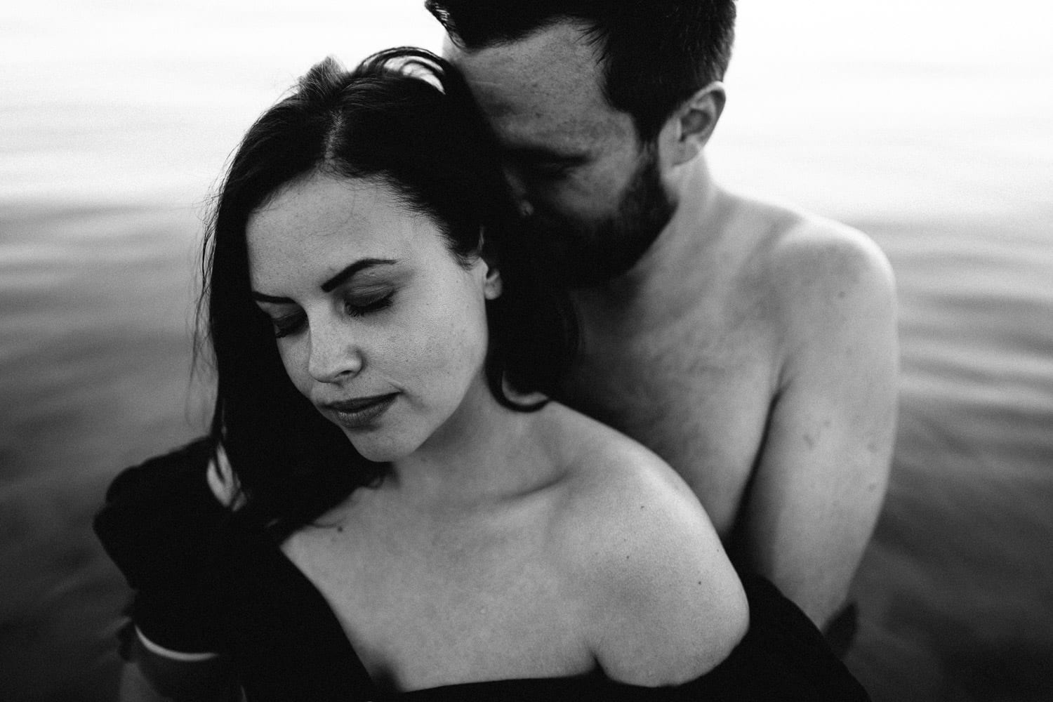 black and white of couple holding each other Engagement Photos Ireland