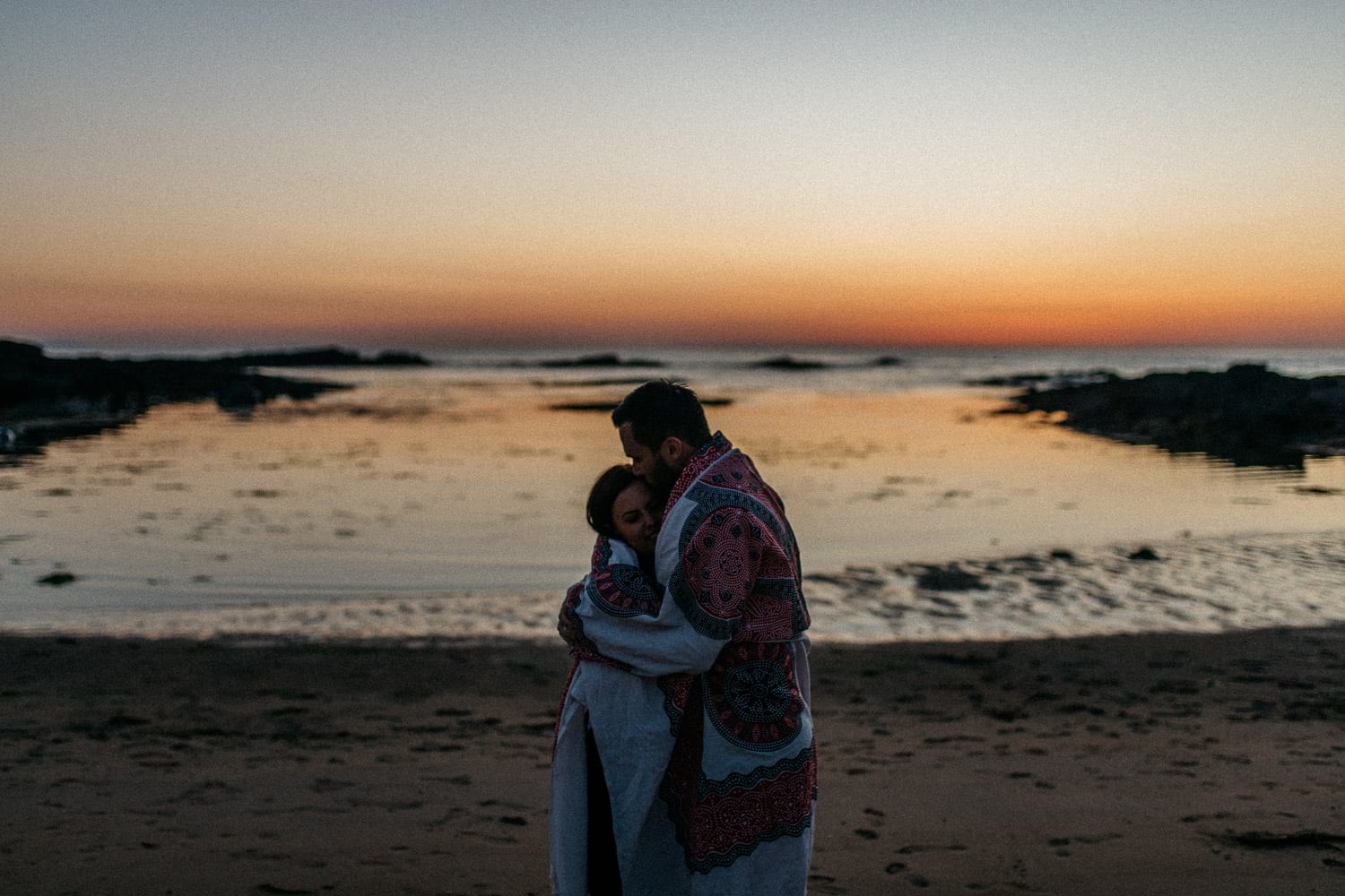 couple hugging at sunset Engagement Photos Northern Ireland