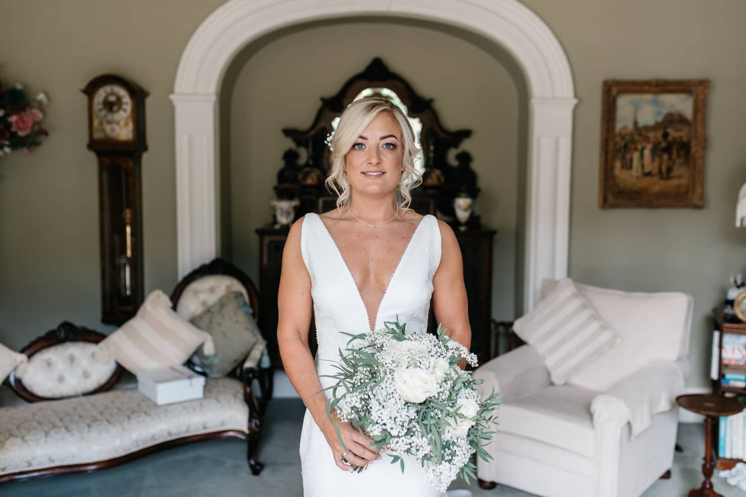 bride holding flowers in family home Wedding Photographer Northern Ireland