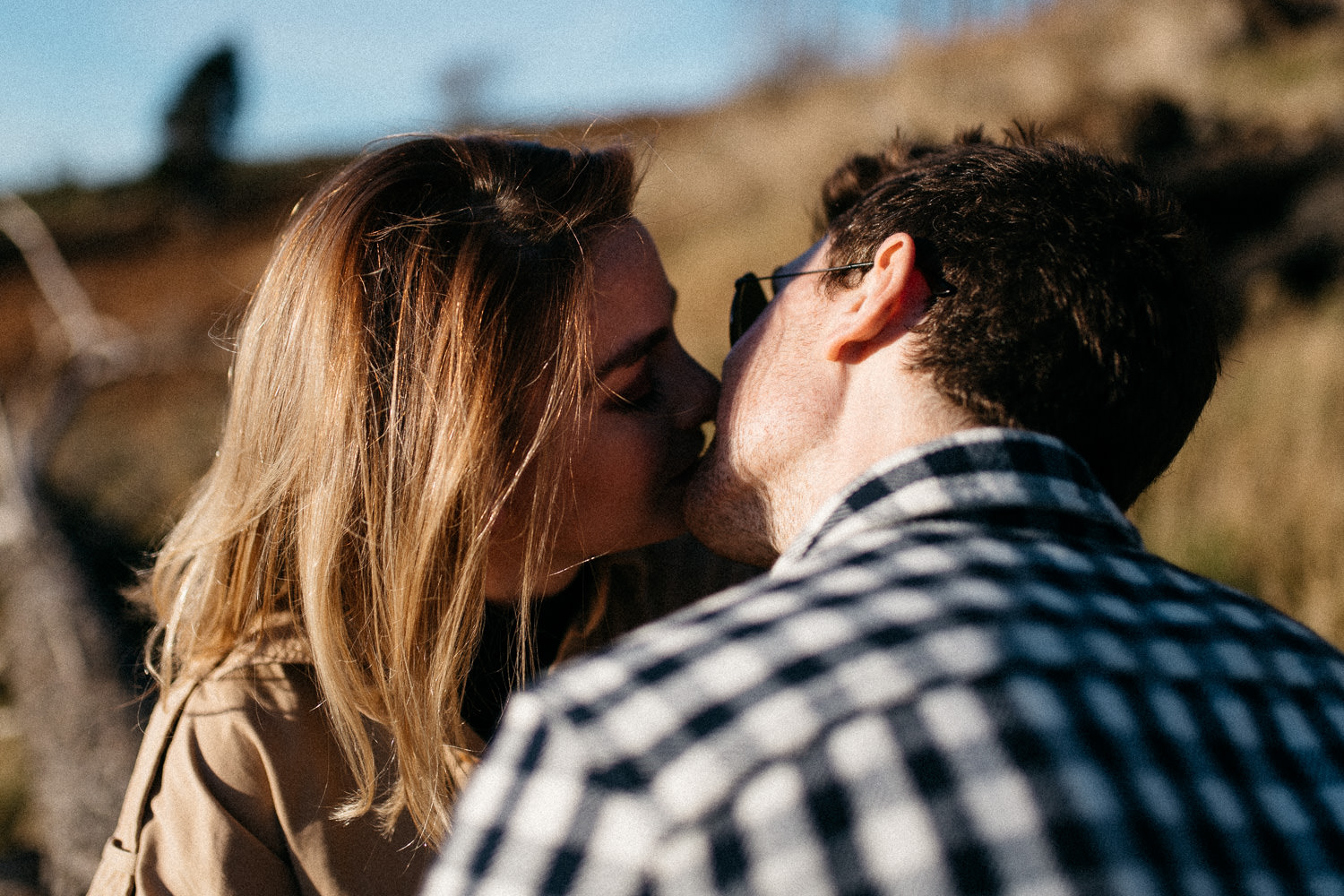 couple kissing at sun set Mourne Mountains Engagement 