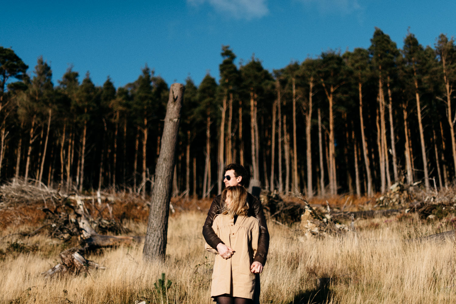 couple stating in front of trees Mourne Mountains Engagement Photography