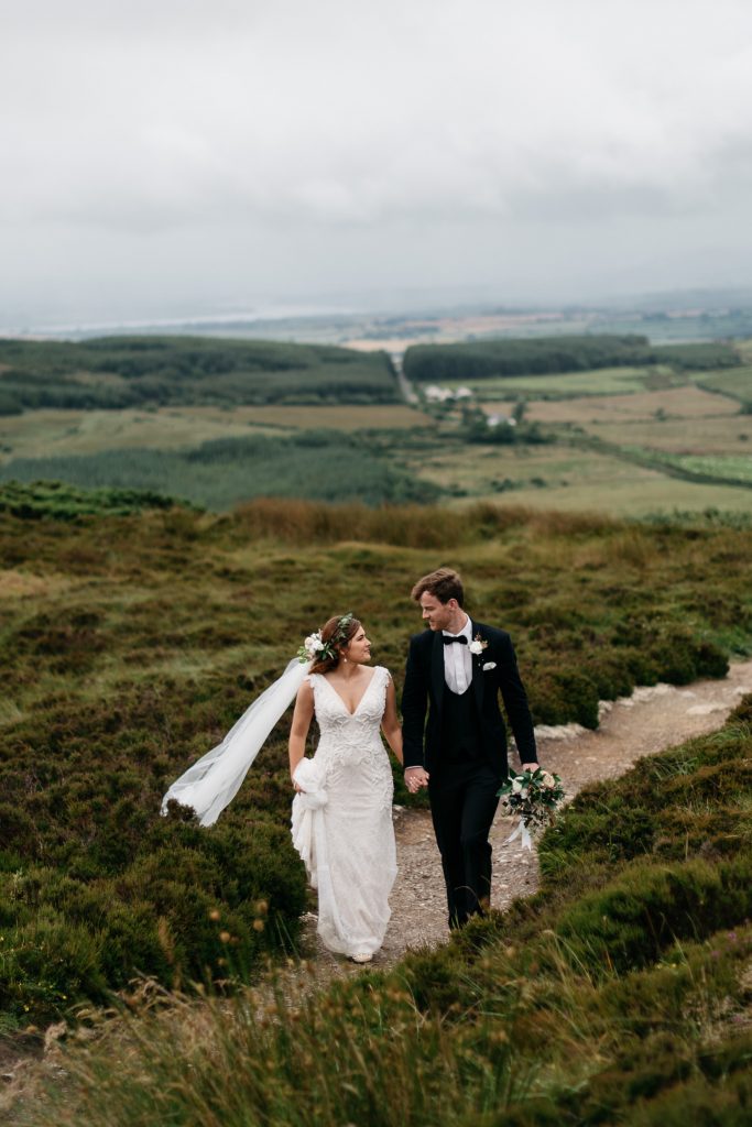 bride and groom holding hands wedding photography Northern Ireland