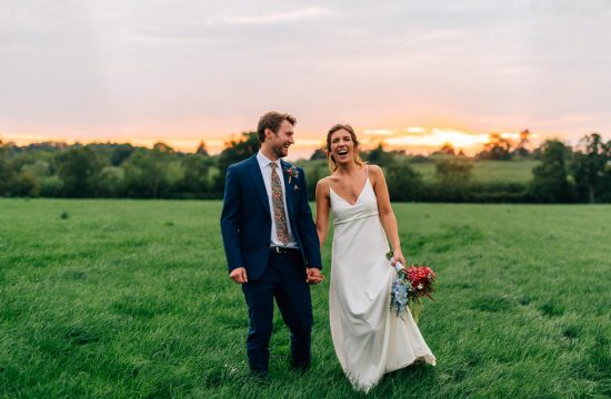 bride and groom laughing holding hands at sunset Gracehall Wedding Photography