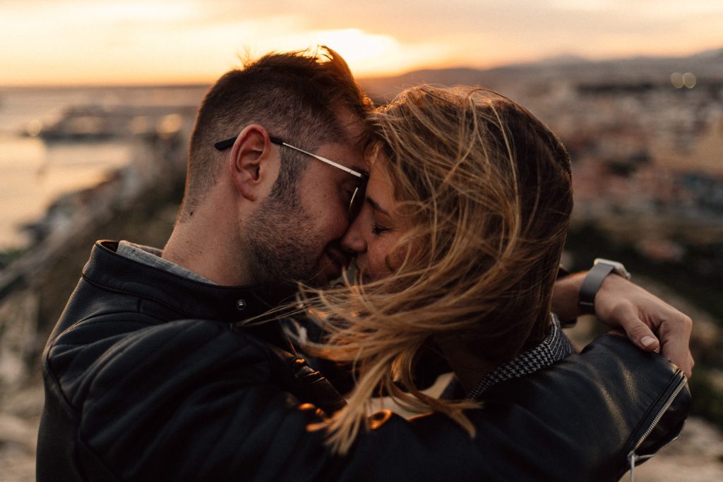 couple kissing at sunset overlooking the city Wedding Photography Barcelona
