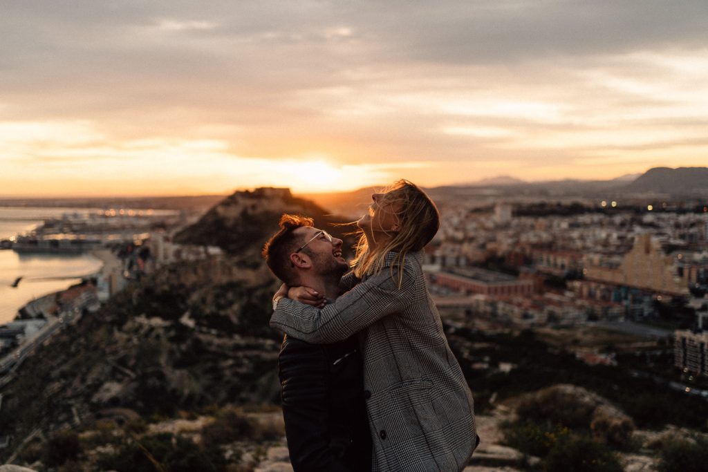 couple hugging and laughing at sunset Wedding Photography Barcelona