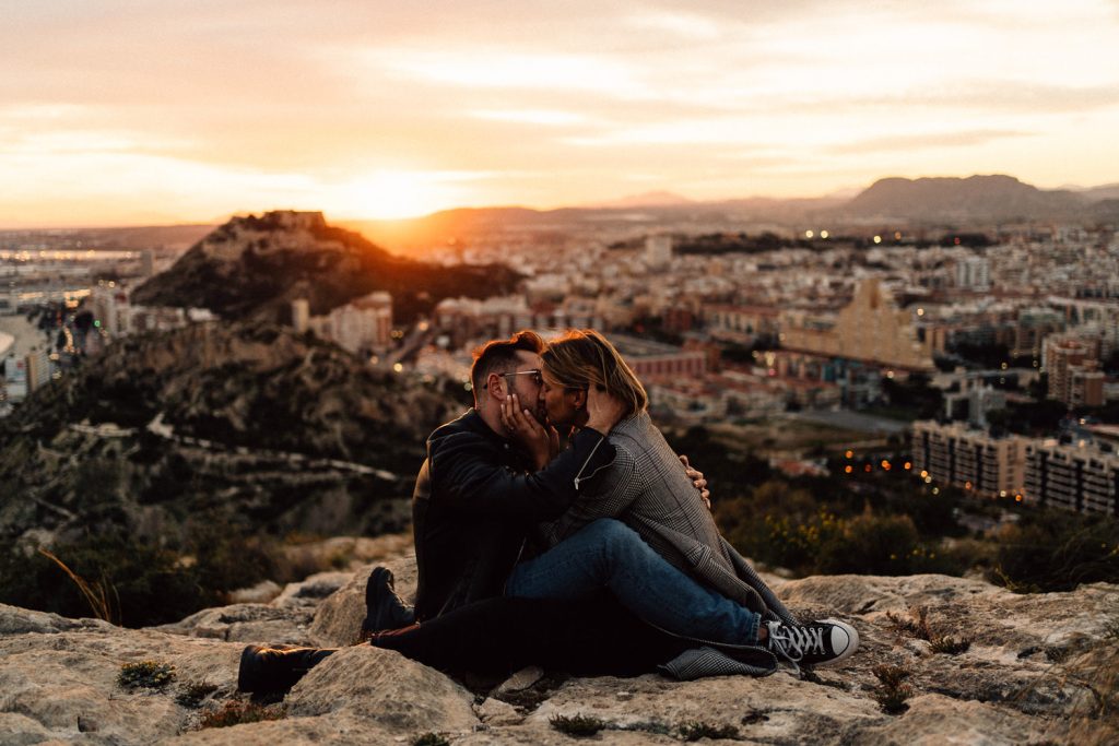 couple kissing at sunset overlooking the city Wedding Photographers Barcelona