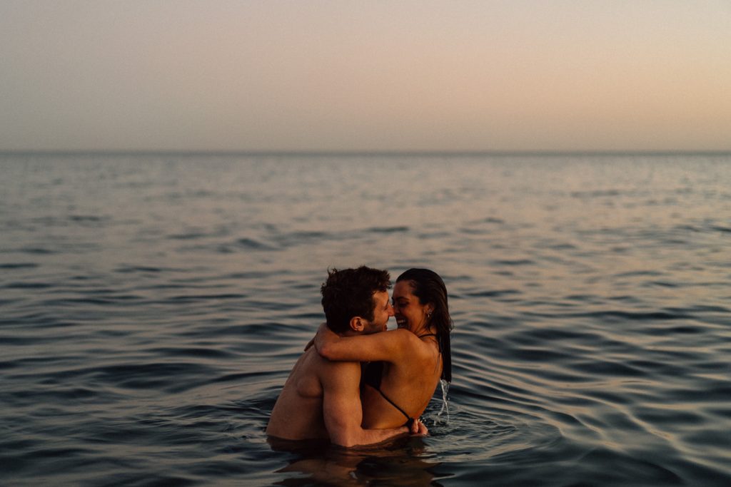 couple playing in the water Barcelona Wedding Photographer