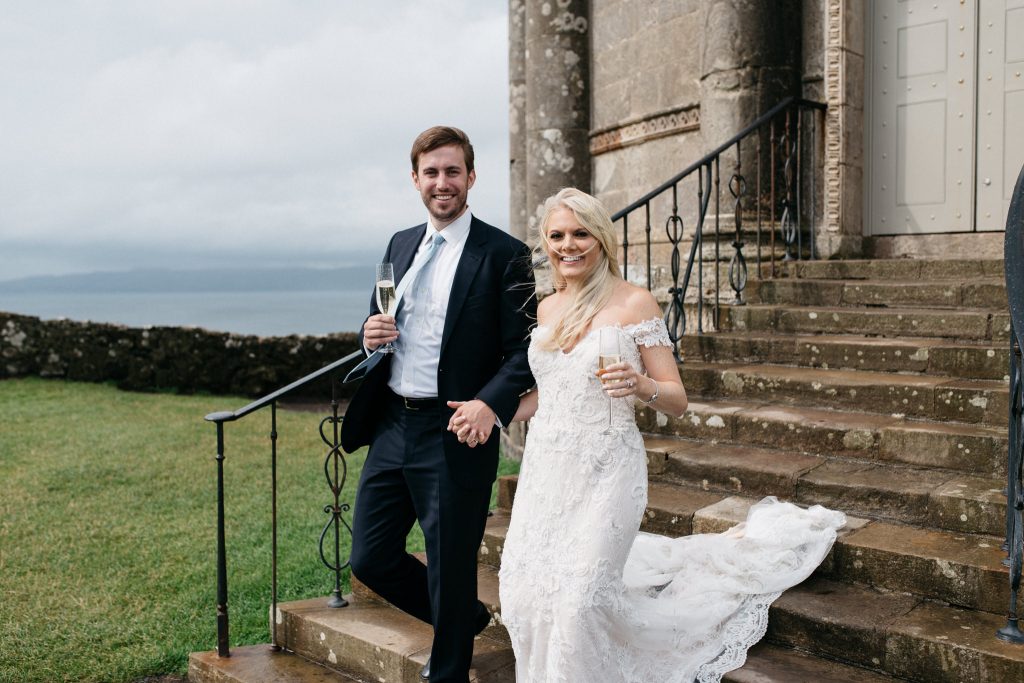 couple leaving Mussenden temple at their wedding Elopement Photographer Ireland