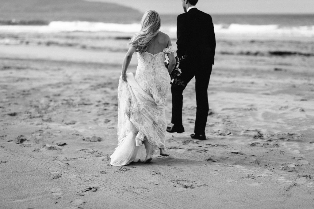 couple walking on the beach Northern Ireland Elopement Photographers