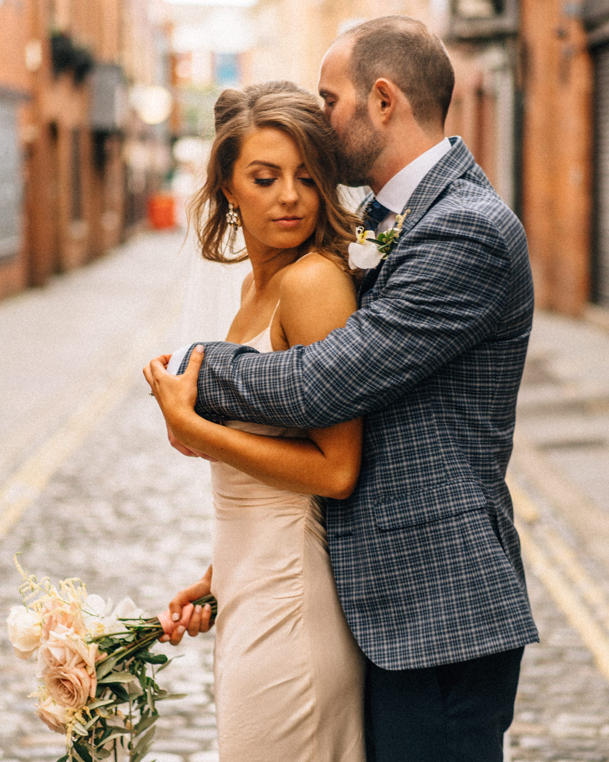 bride and groom hugging Belfast Wedding Merchant Hotel Photos