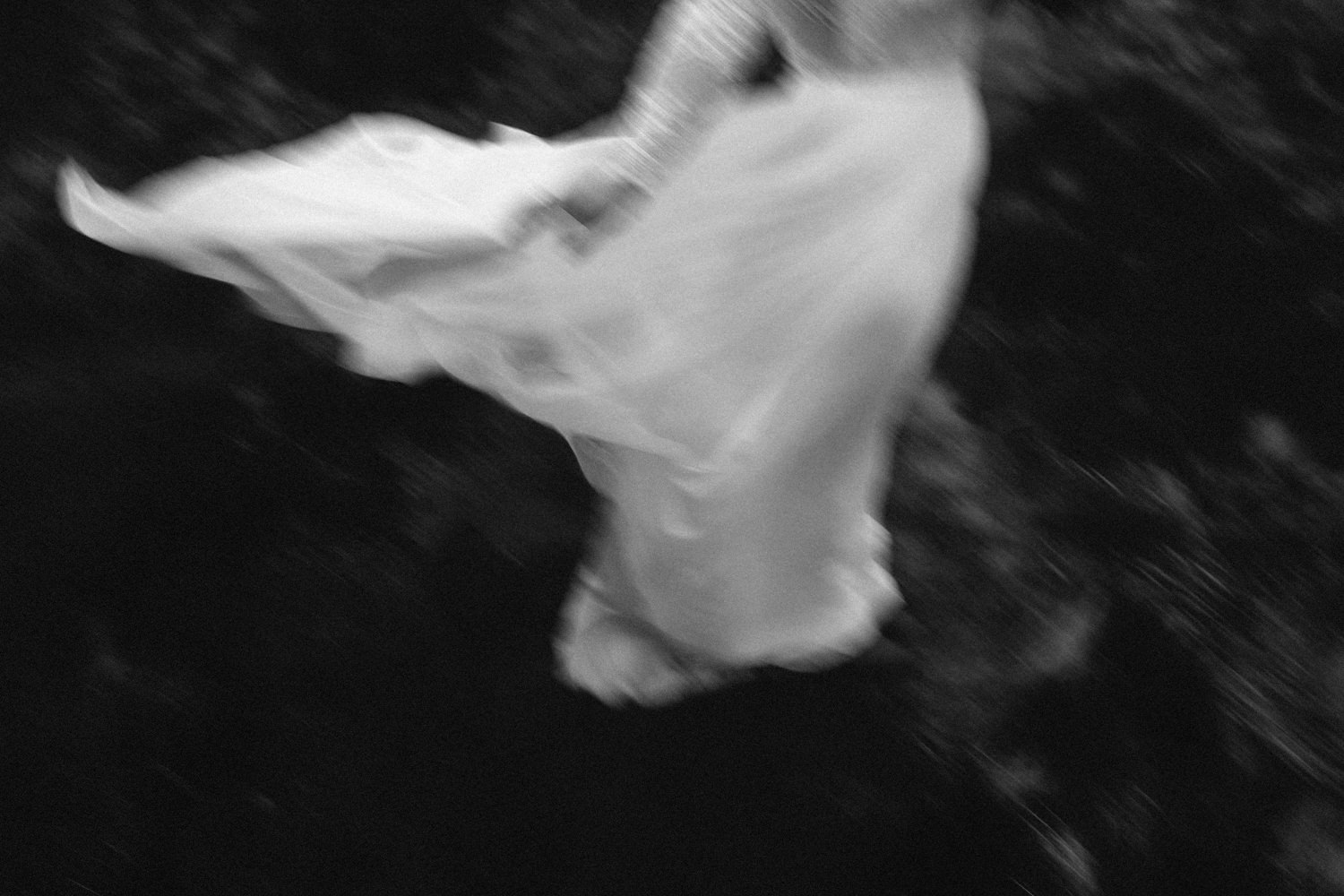 brides dress flowing in the wing motion effect Mourne Mountains Wedding Photography