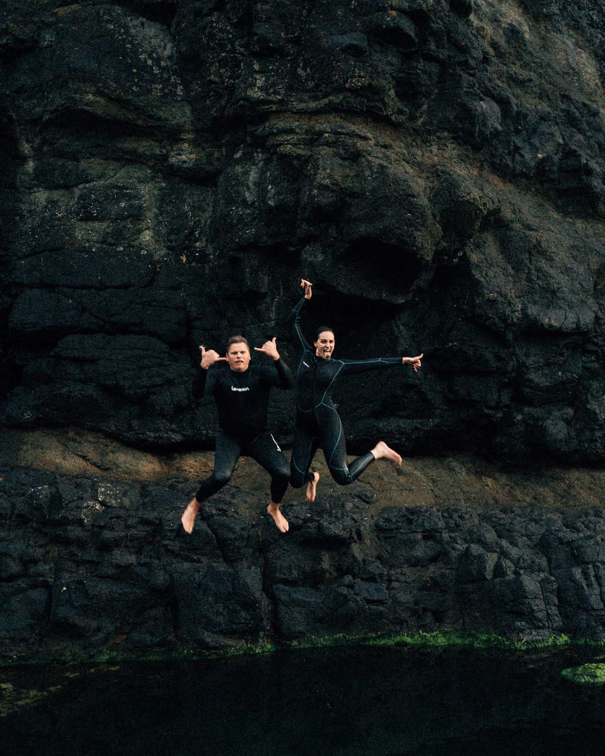 couple cliff jumping on the couples adventure  Elopement Photographer - Couples Photographer