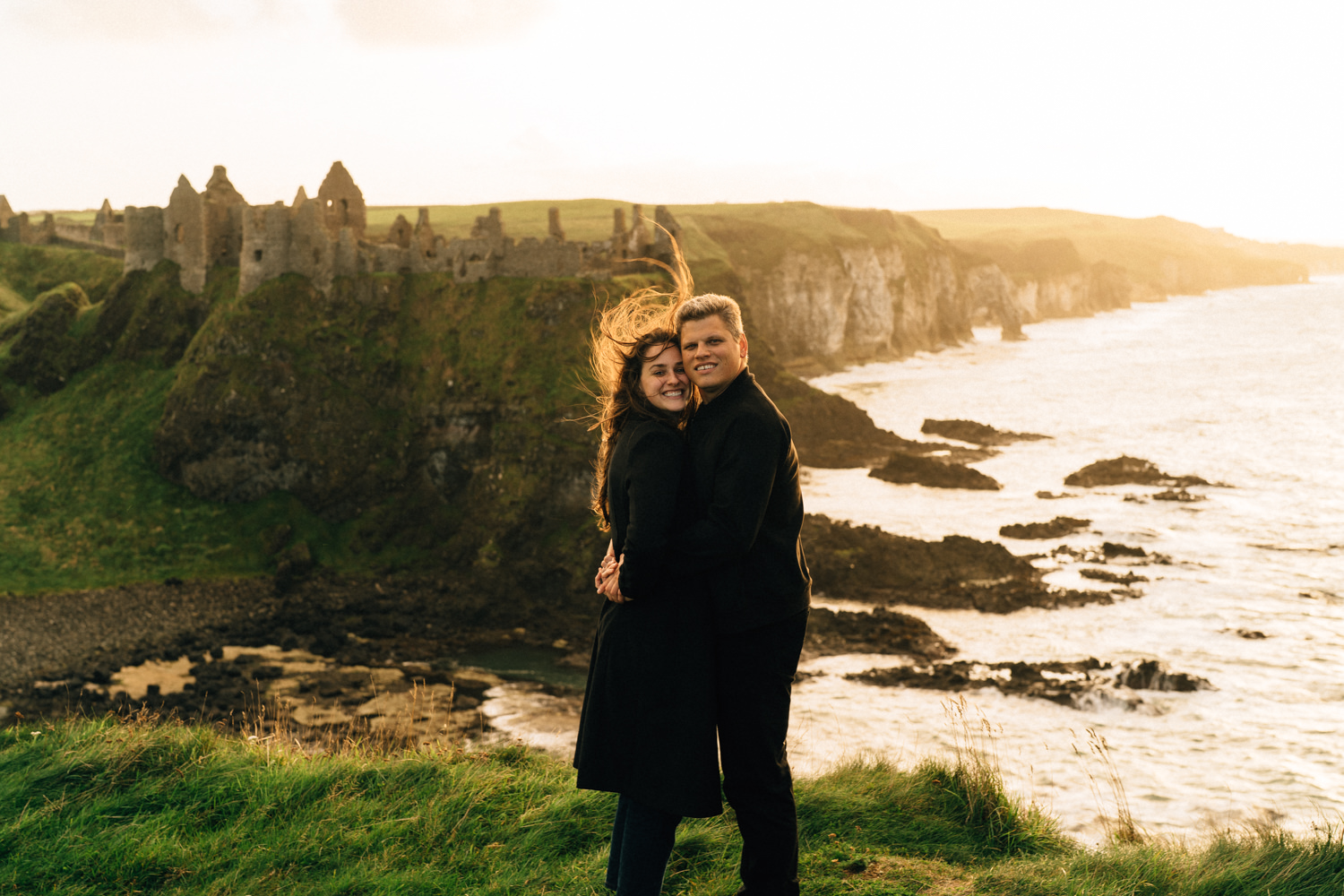 couple posing at Dunluce Castle Northern Ireland Elopement Photographer 