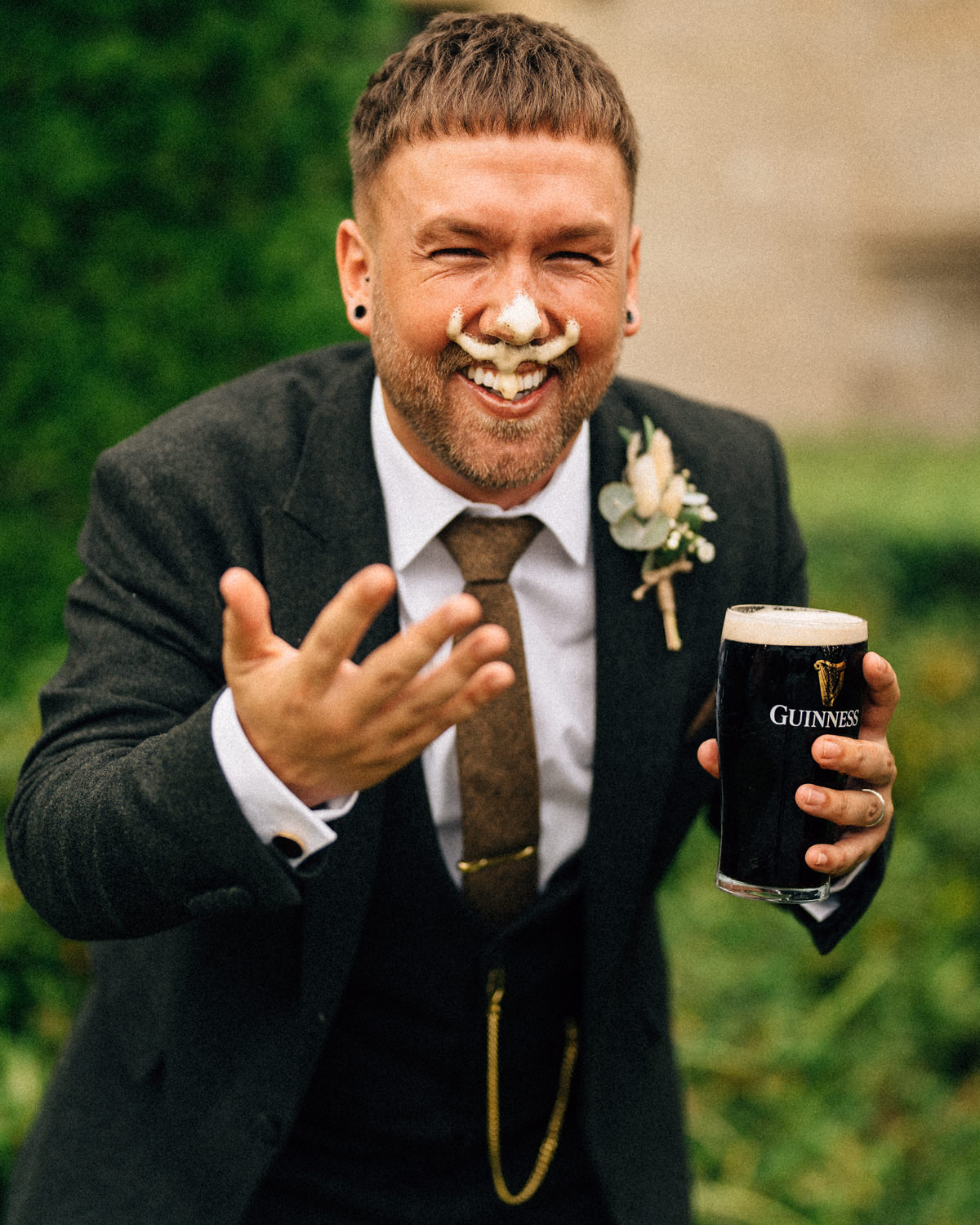 groom spilling Guinness on his face wedding photographers northern ireland