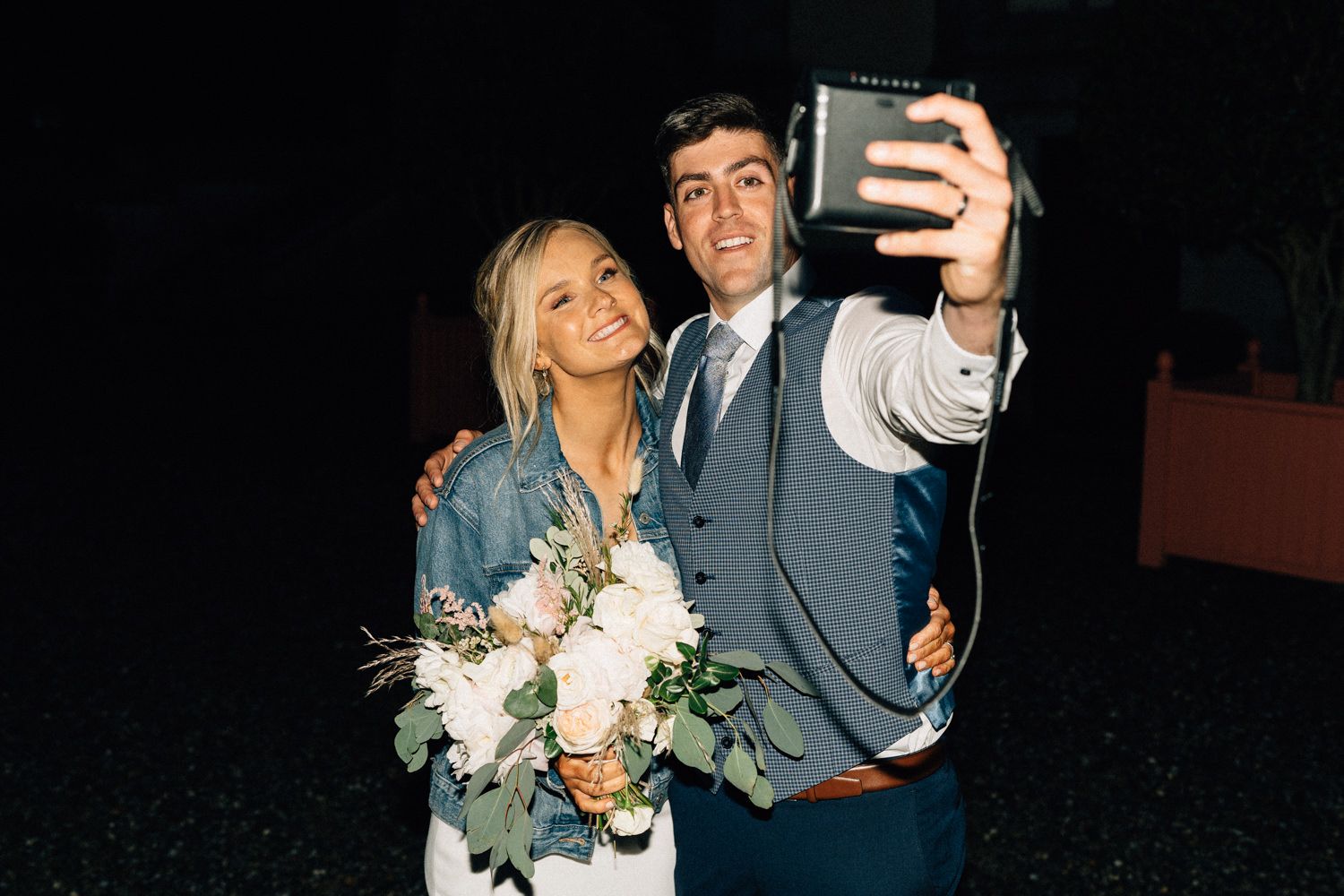 bride and groom taking selfie