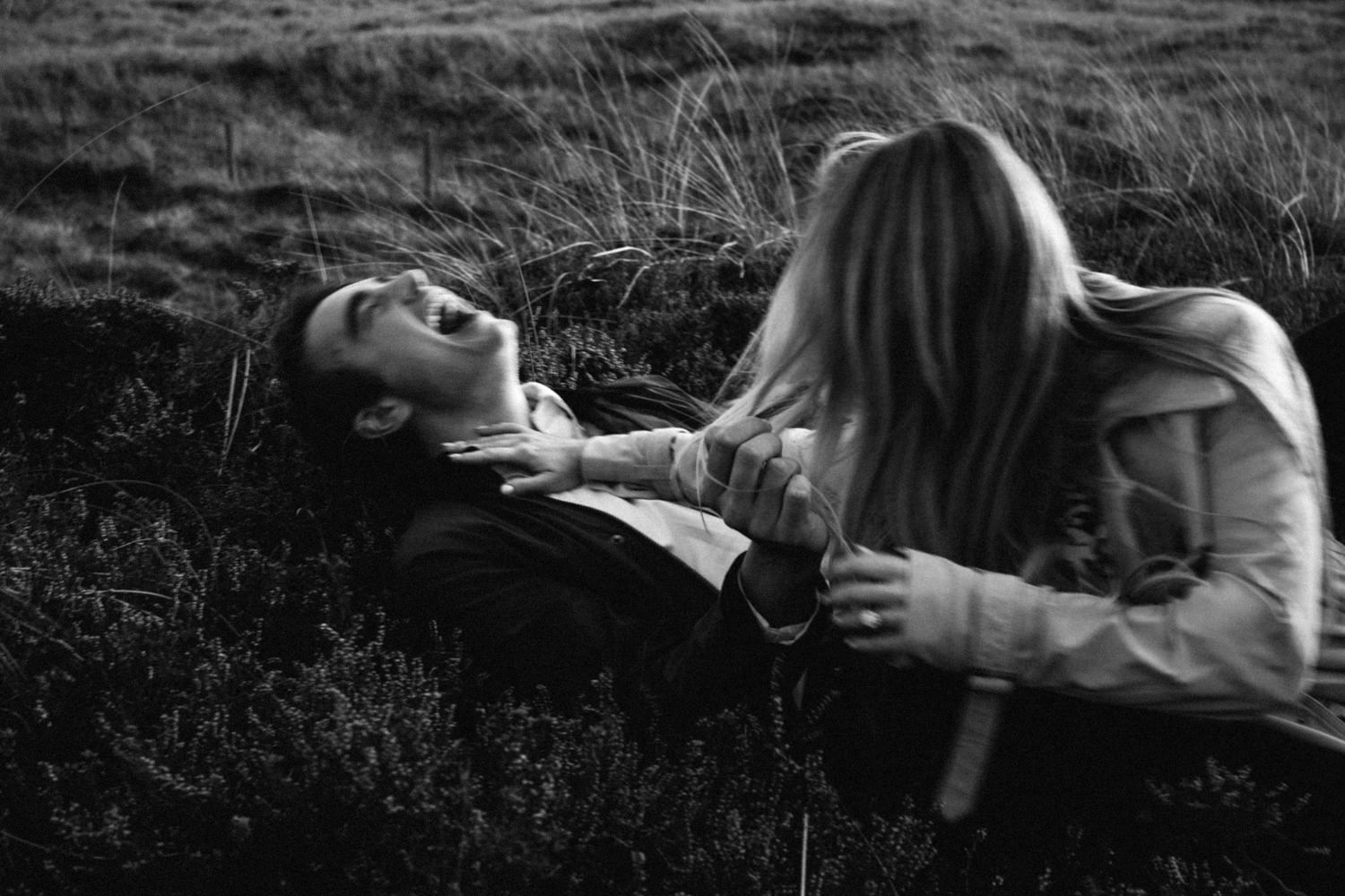 Couple-laughing-in-the-meadow-black-and-white-Film-Photographers-Northern-Ireland