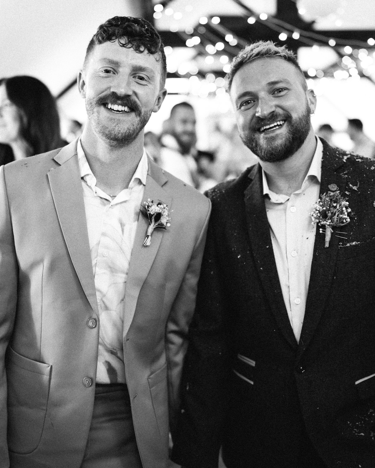grooms posing after walking down the aisle LGBTQ Wedding Photographer Ireland