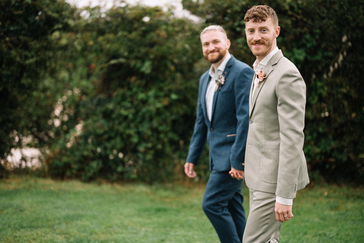 same sex wedding grooms walking holding hands LGBTQ Wedding Photographer Ireland