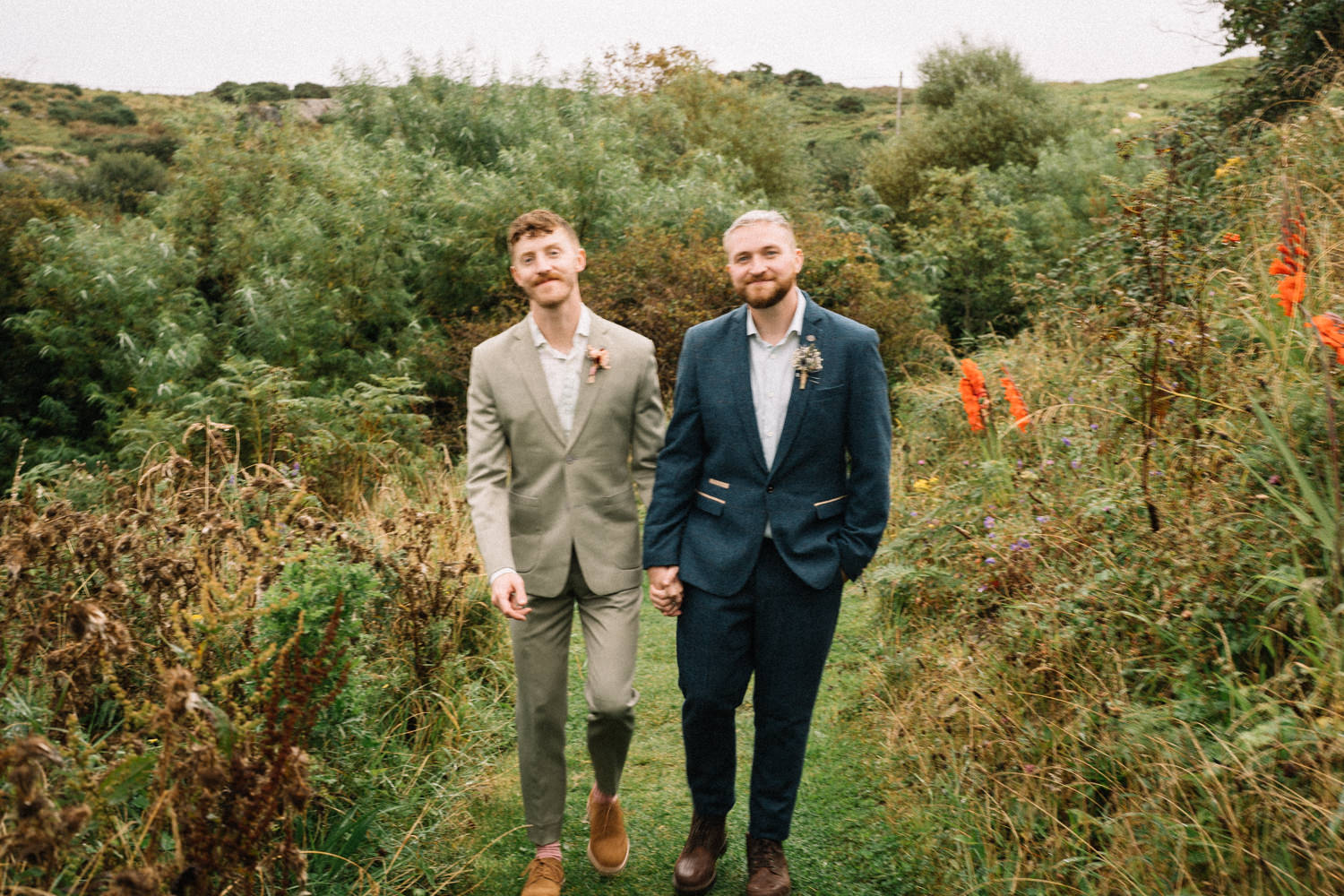 grooms walking in garden in donegal LGBTQ Wedding Photographer Ireland