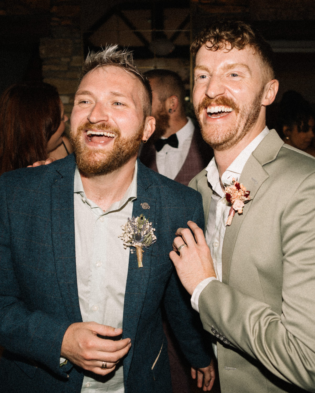 grooms laughing on dance floor gay wedding LGBTQ Wedding Photographer Ireland