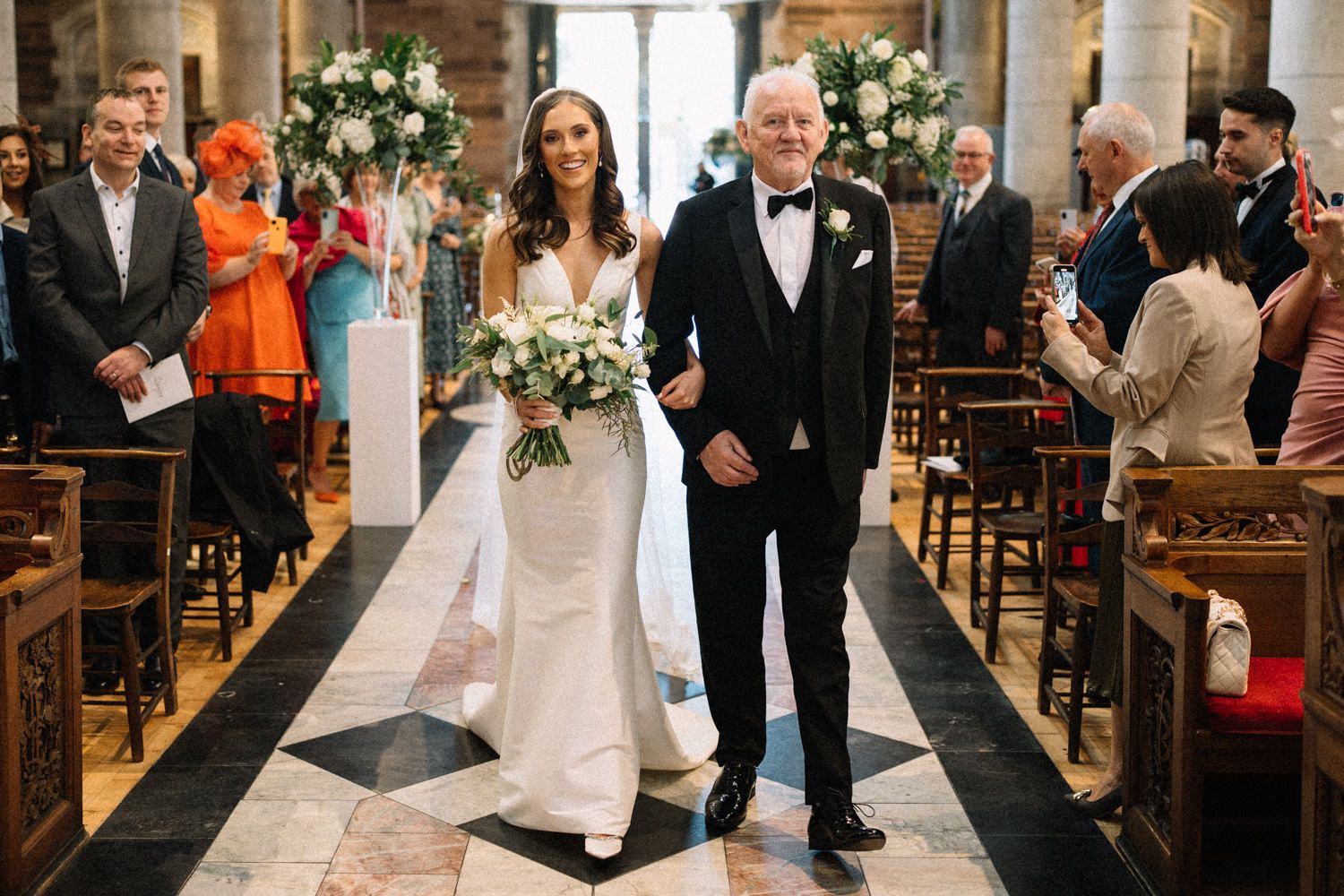 bride-walking-down-the-isle-with-her-father-st anne's-cathedral-belfast-Belfast-Wedding-Photographer