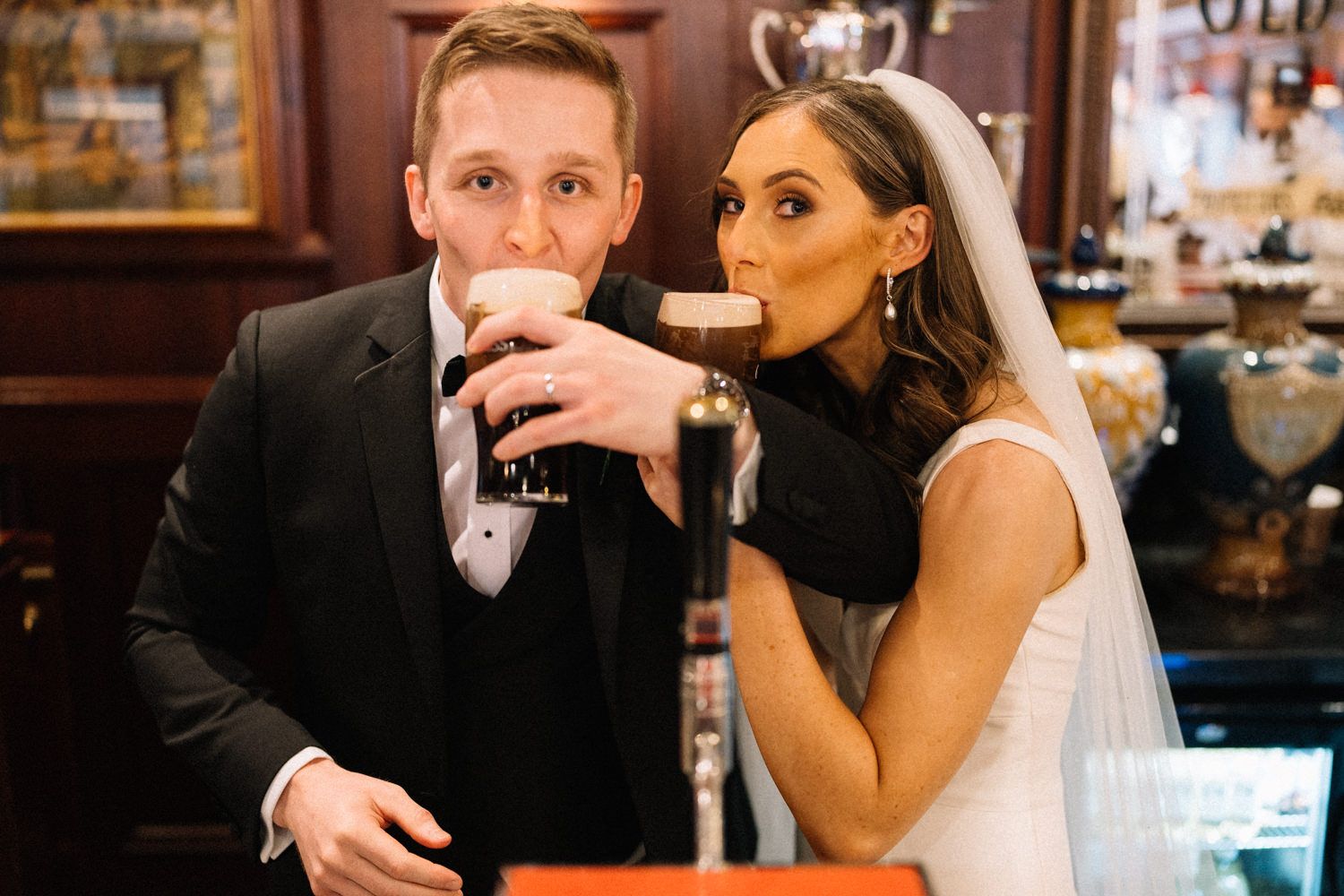 bride-and-groom-having-guinness-Belfast-Wedding-Photographer