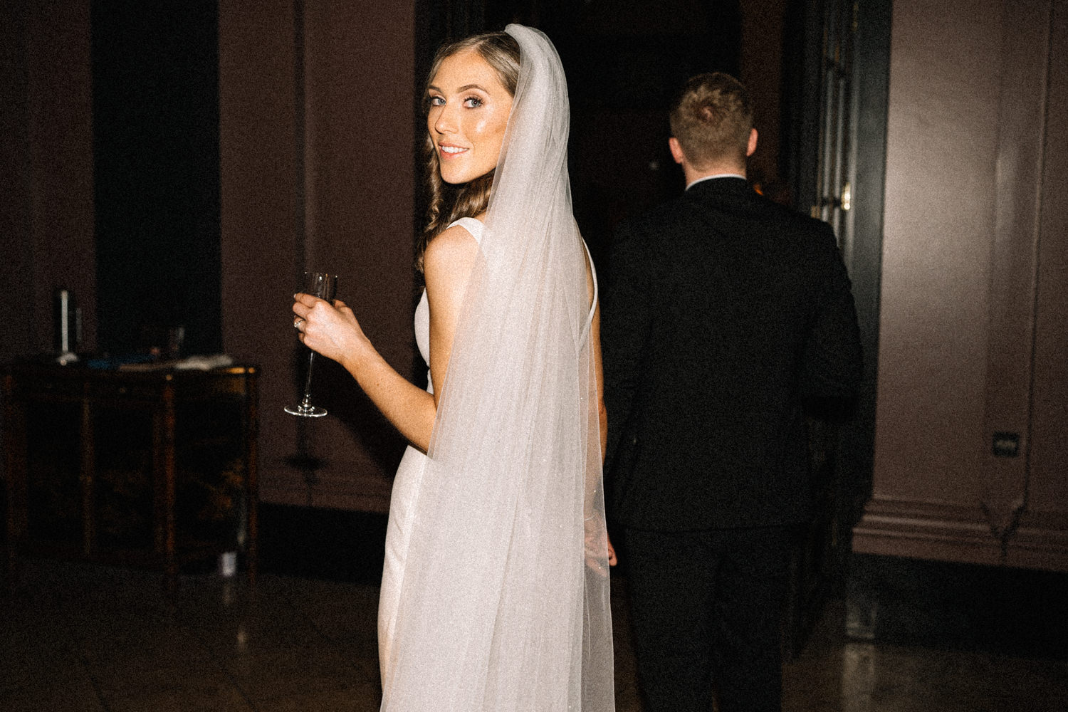 bride-looking-back-the-merchant-hotel-wedding-Belfast-Wedding-Photographer