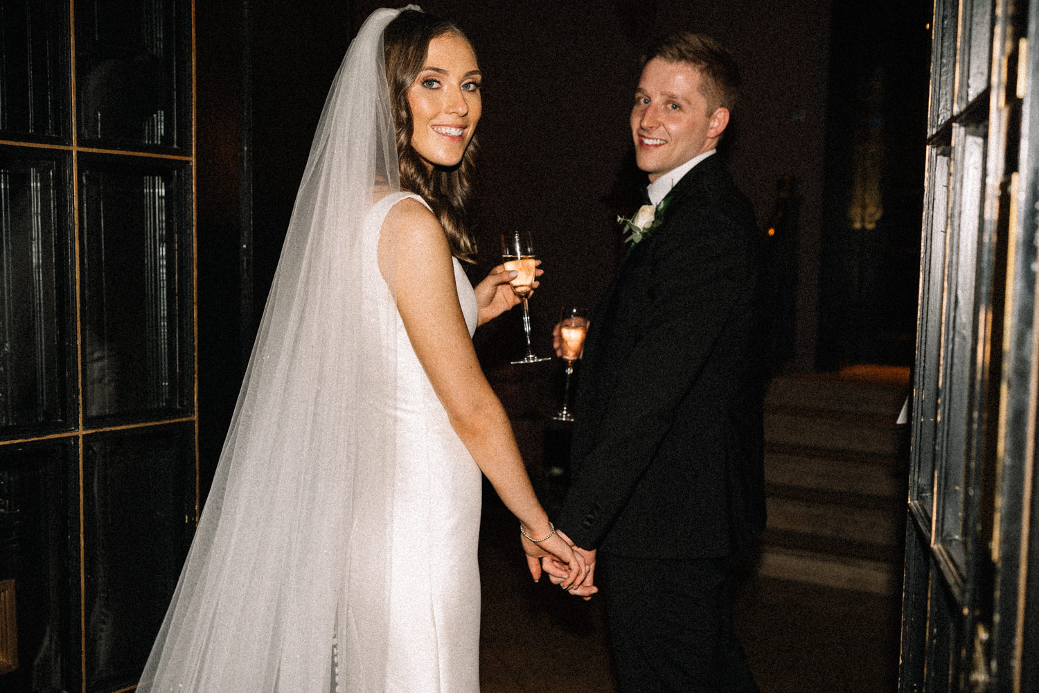 bride-and-groom-looking-back-the-merchant-hotel-wedding-Belfast-Wedding-Photographer