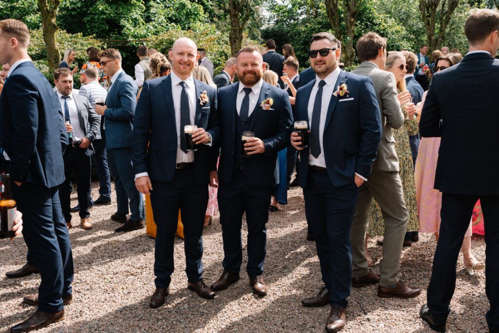 ulster rugbys Andrew Warwick with friends having drinks Larchfield Estate Wedding Photos