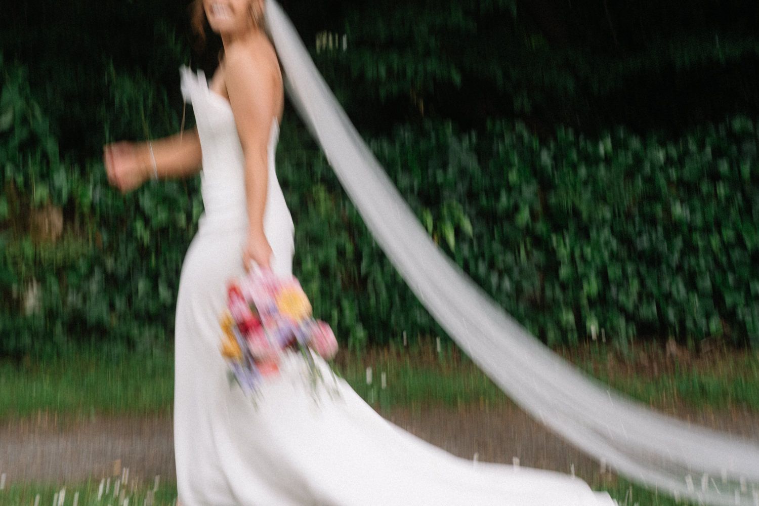 bride walking away holding flowers Larchfield Estate Wedding Photos