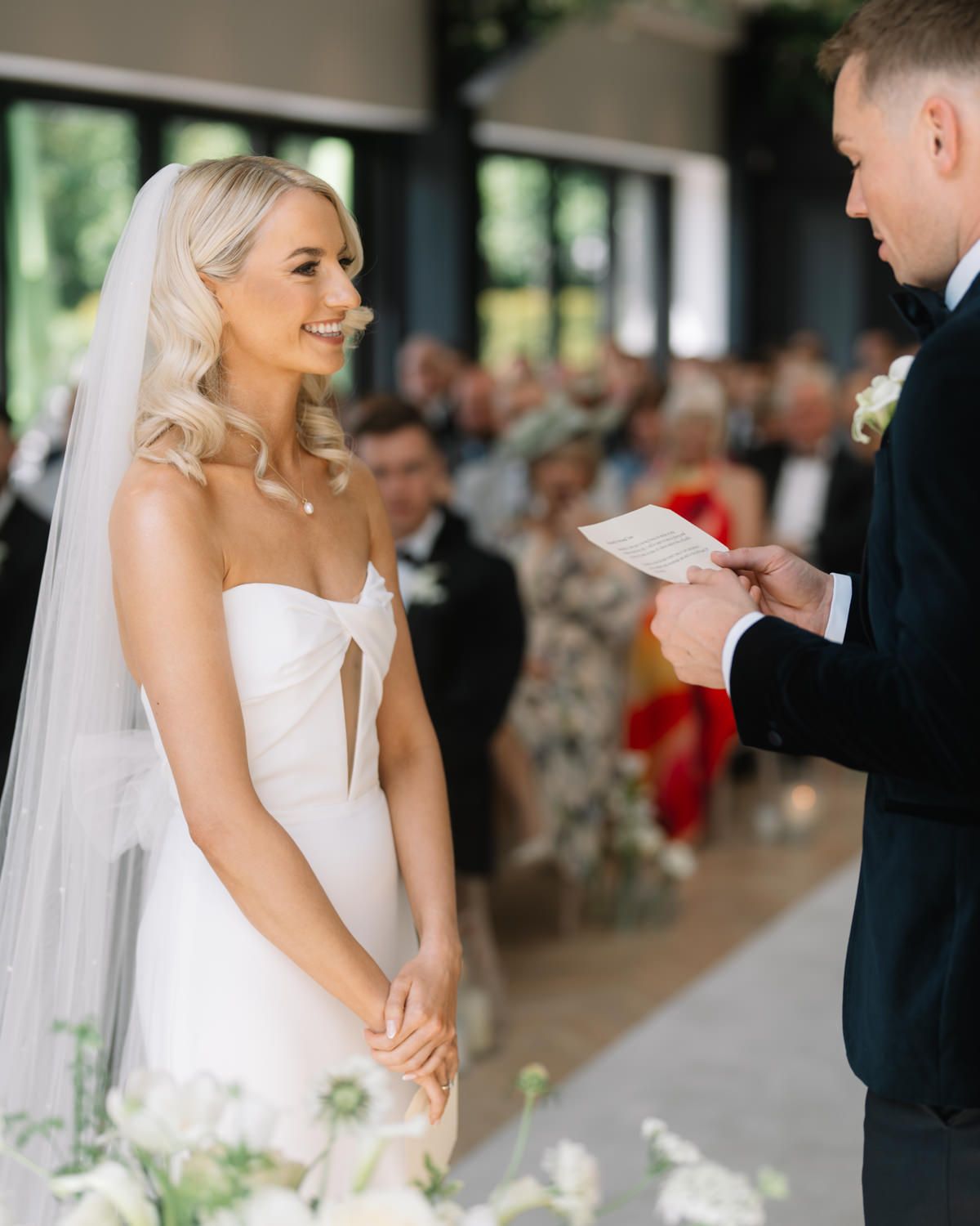 groom reading vows to bride Captured by a Cabra Castle Wedding Photographer
